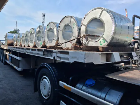 PAL flatbed truck carrying steel coil cargo