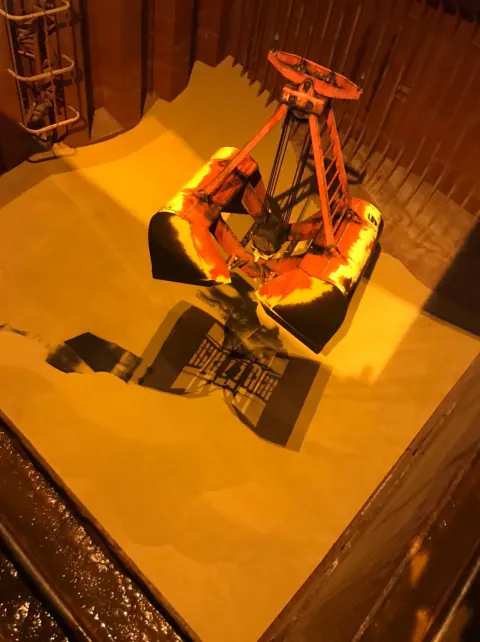 PAL overhead cargo lifting documentation at night