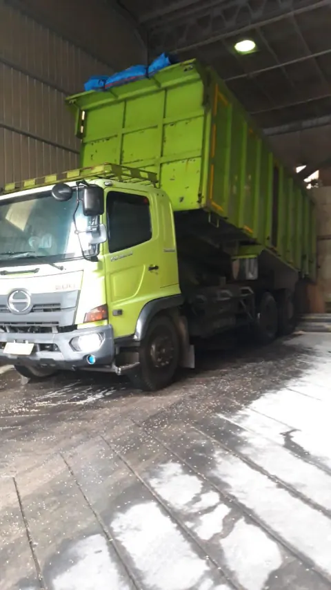 PAL green cargo truck documentation inside warehouse